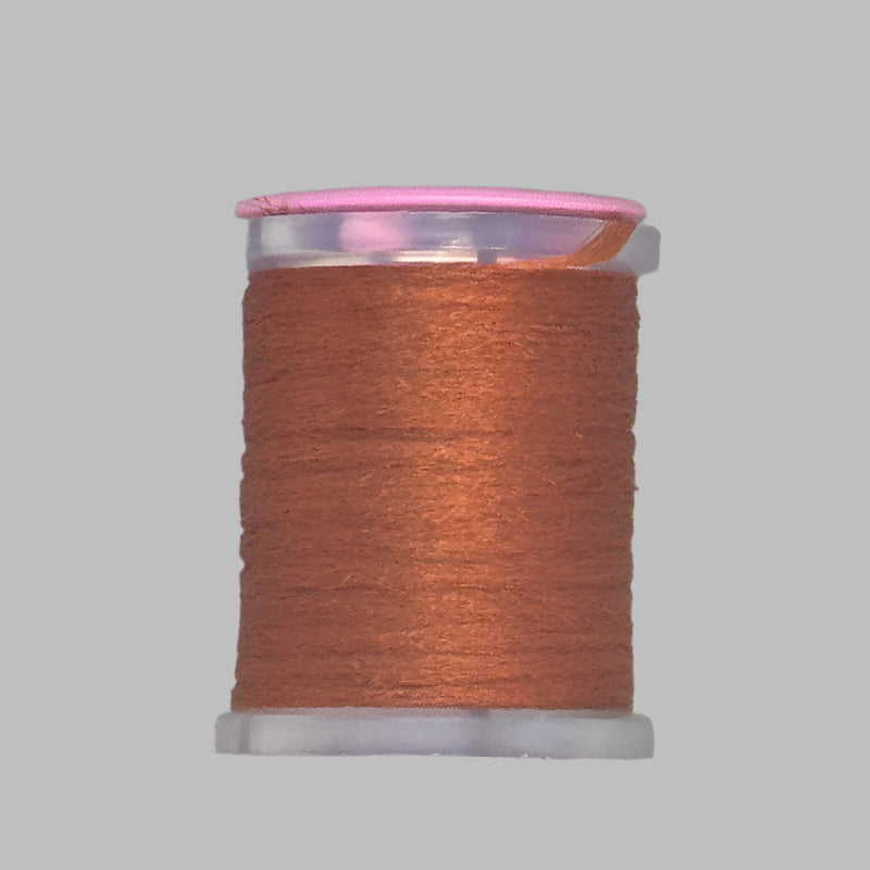 UTC Antron yarn spool in brown on a clear bobbin with pink top ring
