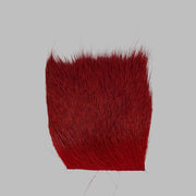 Red deer hair patch with dense fibers and uneven trimmed edge
