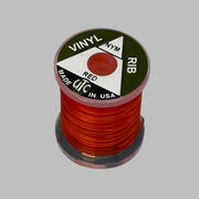 Spool of vinyl rib trim in red with coiled strand