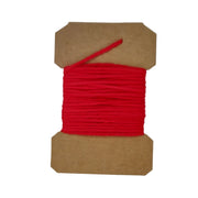 Wool yarn spool with red yarn wrapped on brown cardboard core, short end strand.