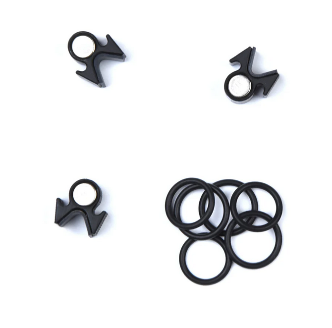 Set of three black magnetic clips with round white center for mounting