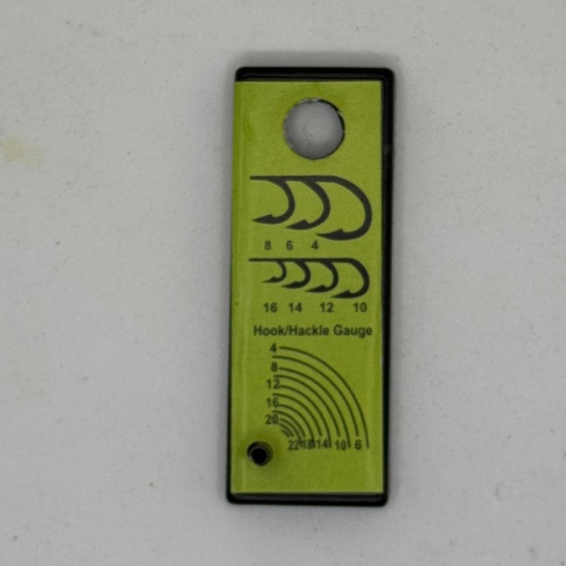 Hook and hackle gauge tool with measurement markings on green card