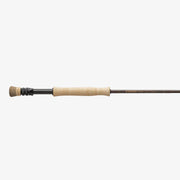 Fishing rod with cork grip and black reel seat, straight graphite blank