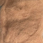 Rabbit dubbing material in light brown, soft shaggy fibers.