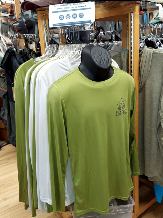 Display of long-sleeve shirts and caps in a store setting
