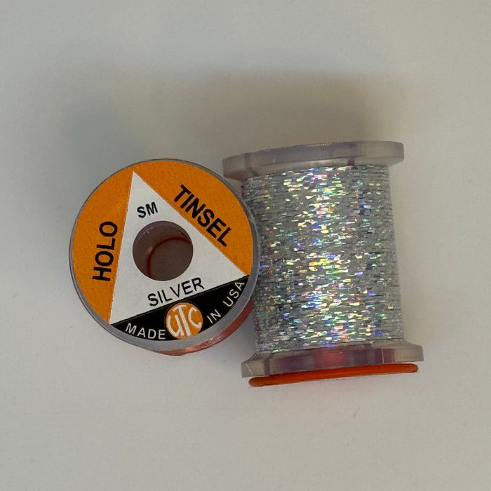 2 Spools of Silver Tinsel from two angles, one with label showing