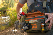 Lumbar pack worn, open organizer with orange trim and bottles in side slots