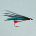 Close up of streamer fly with peacock blue, red and silver accents