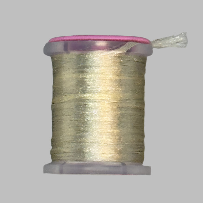 Close up spool of tan colored Antron yarn