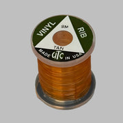Vinyl D-rib spool of Tan vinyl trim, wound on a small reel