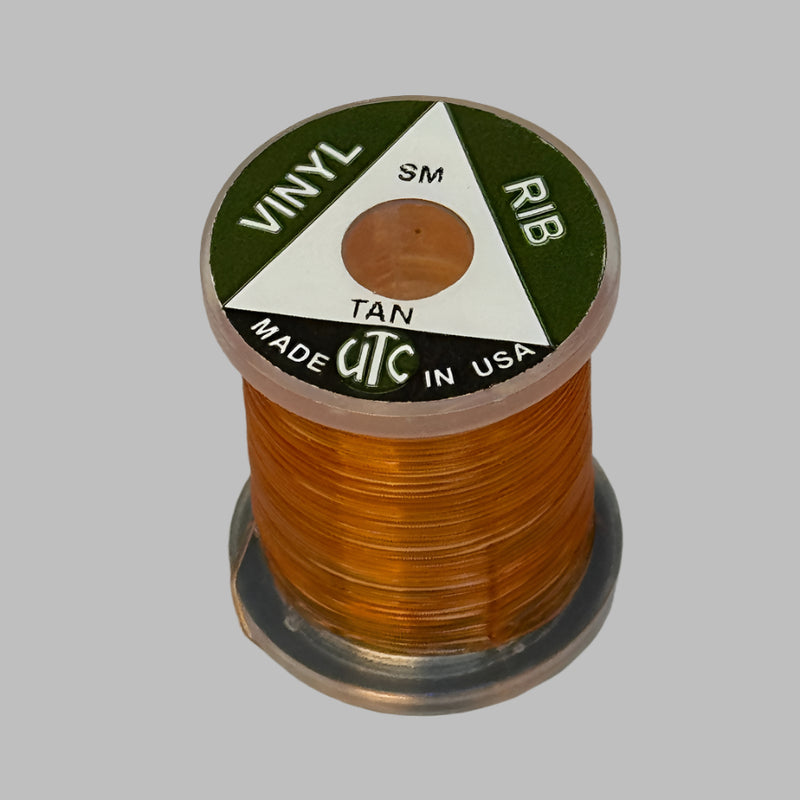 Vinyl D-rib spool of Tan vinyl trim, wound on a small reel