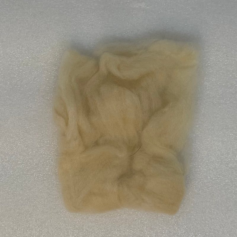 Light beige fly tying dubbing fibers clump, soft and fluffy