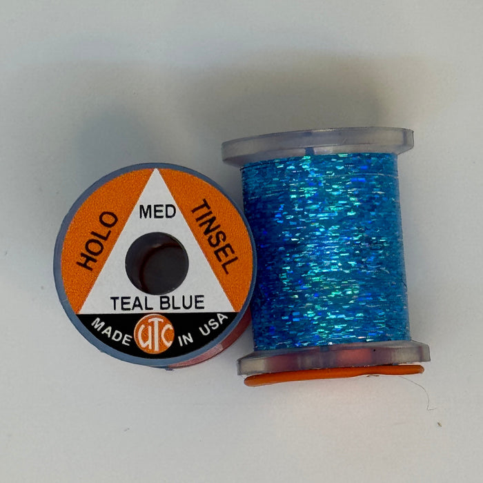 2 Spools of Teal Blue Tinsel from two angles, one with label showing