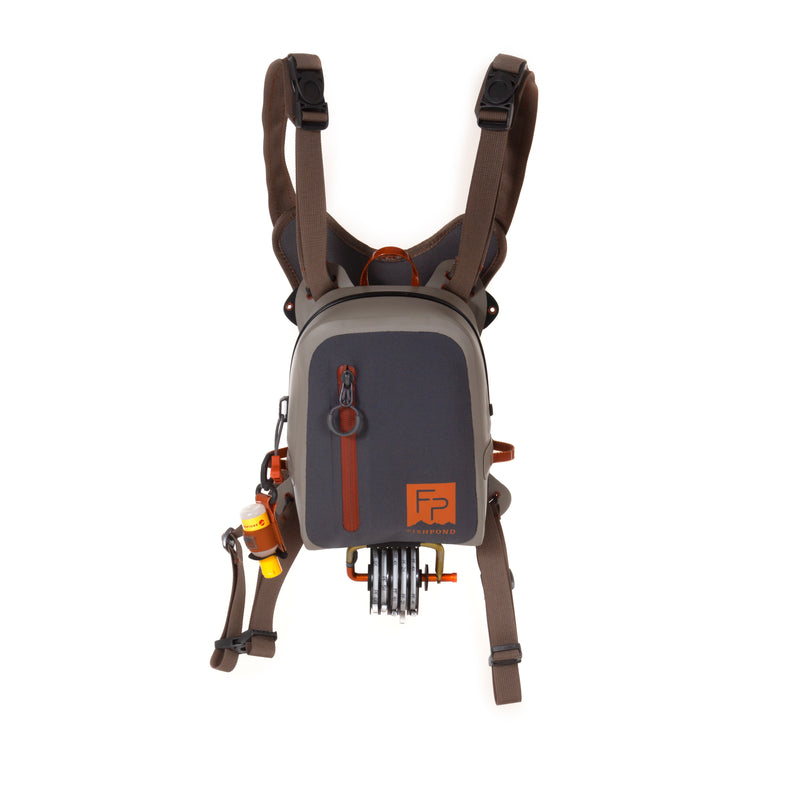 Fishpond Thunderhead chest pack in dark gray with brown adjustable shoulder straps
