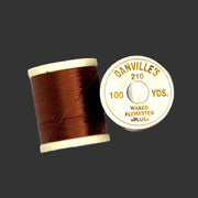 Waxed flymaster plus thread spool in dark brown, with printed label