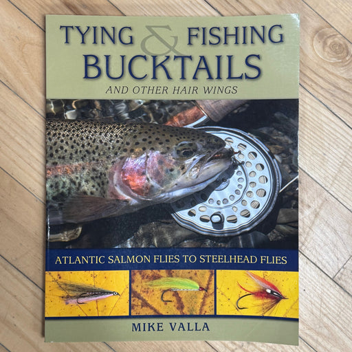 Cover of book with fish, reel and flies