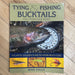 Cover of book with fish, reel and flies