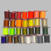 UTC Antron yarn spool set with assorted colors on stacked bobbins