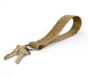 Key fob with tan and multicolor dot-pattern strap and gold keyring, keys attached