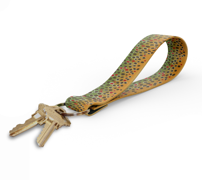 Key fob with tan and multicolor dot-pattern strap and gold keyring, keys attached