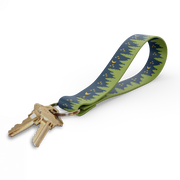 Key fob with green tree-pattern strap and gold keyring, keys attached