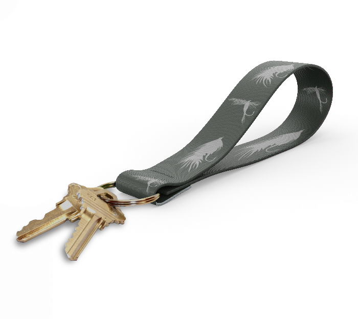 Key fob with dark gray leaf-pattern strap and gold keyring, keys attached