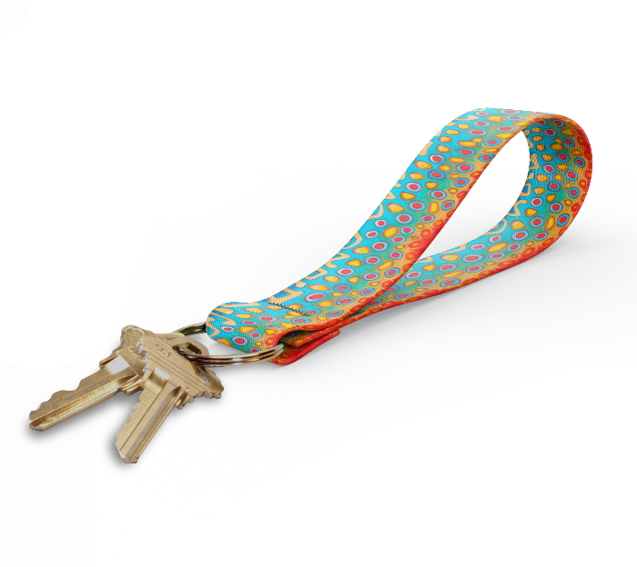 Key fob with bright multicolor dot-pattern strap and gold keyring, keys attached