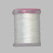 Close up spool of white Antron yarn 031