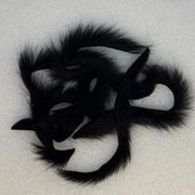 Black squirrel zonkers with long fur strips and tapered tips