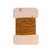 Fine rayon chenille thread spool in tan with top and bottom pads