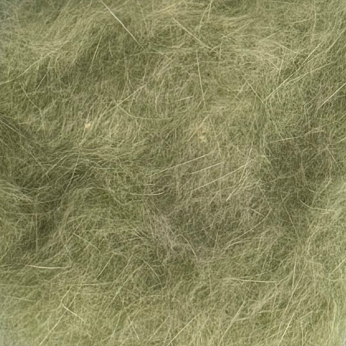 Close up of watery olive colored dubbing