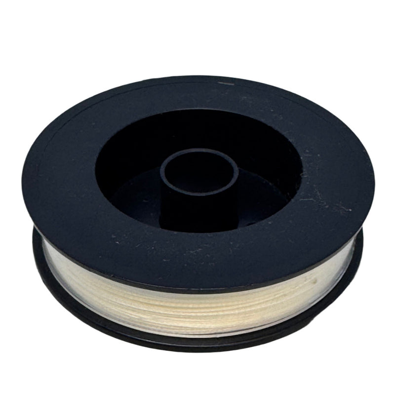 Fly line backing spool with off-white line wound on dark gray/black reel