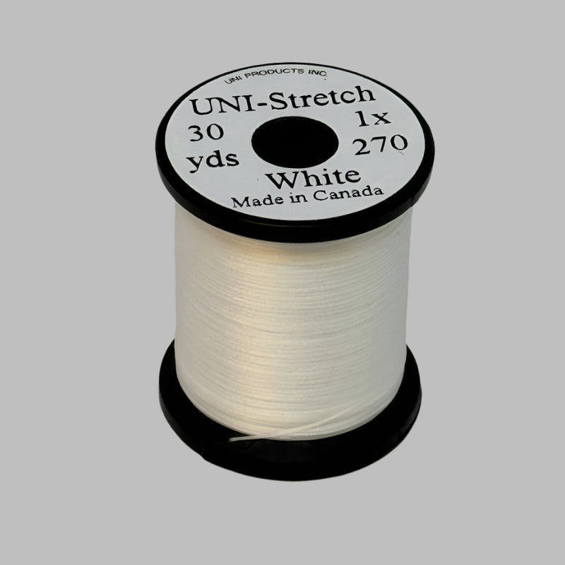 White stretch thread spool with label on top, 30 yd