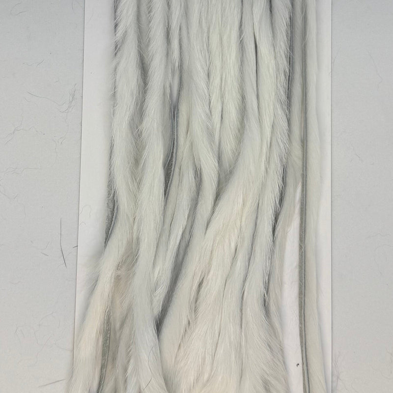 Rabbit half-skin fur hide close-up, zonked shag, white
