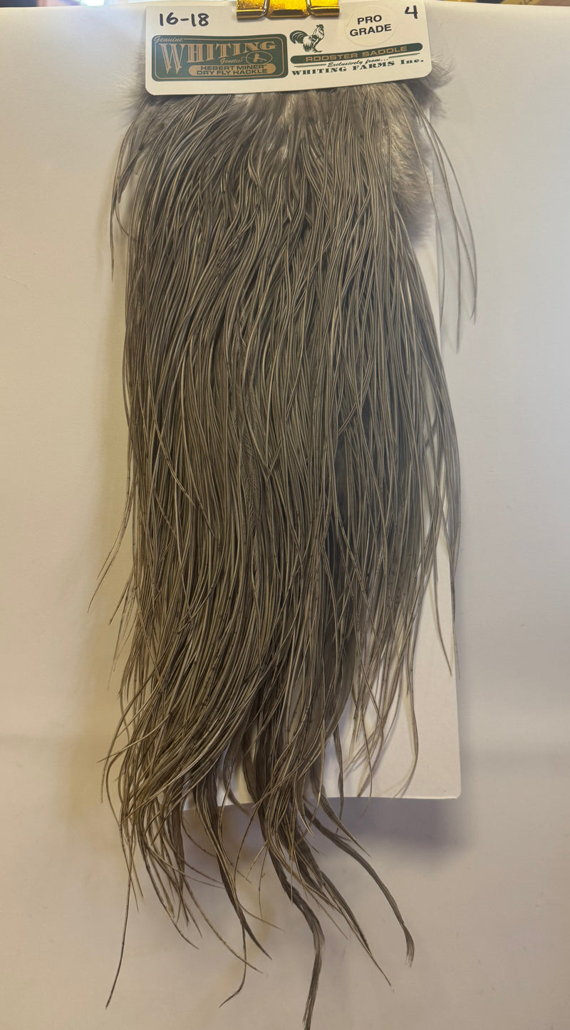 Miner saddle feathers, medium grey dun, fringed fibers in fuller fan shape