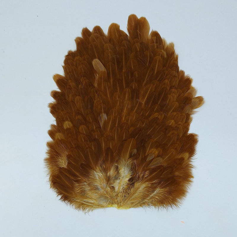 Brown hen saddle feather cluster with layered, fan-like tips