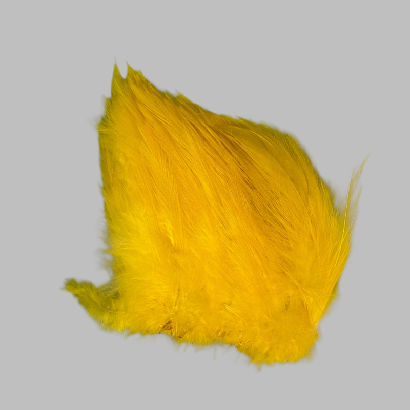 Strung neck hackle feathers, yellow with layered wispy fibers