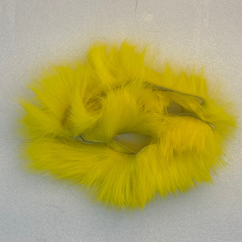 Crosscut rabbit fur strands in bright yellow