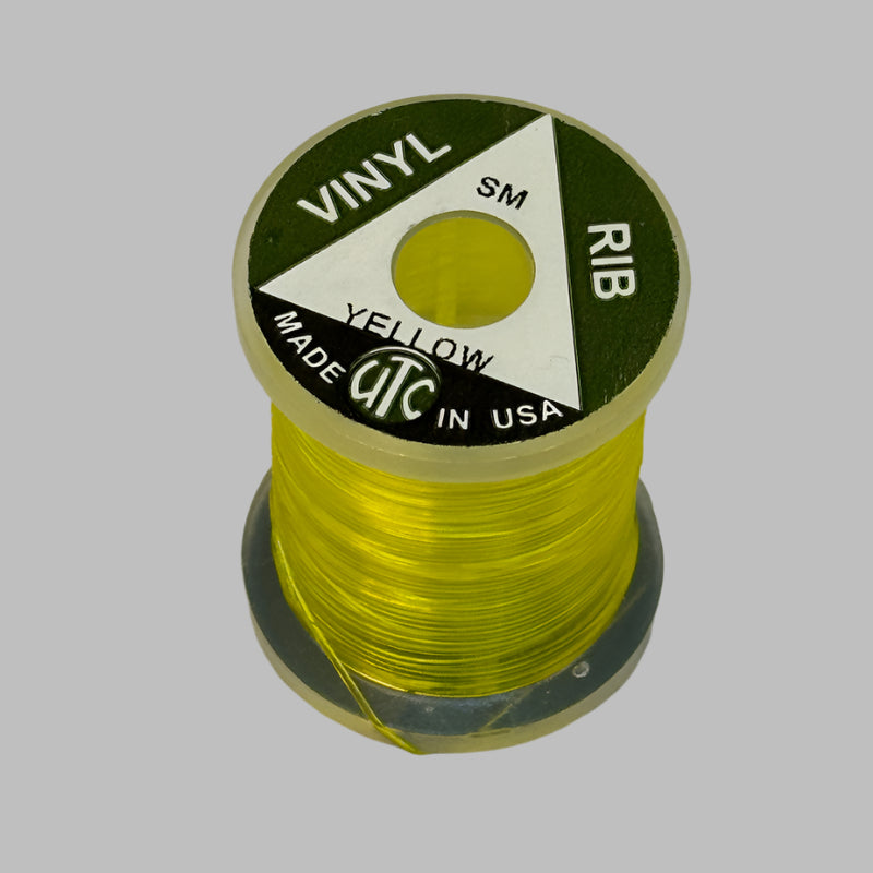 Spool of vinyl rib trim in yellow with coiled strand