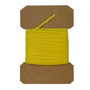Wool yarn spool with yellow yarn wrapped on brown cardboard core.