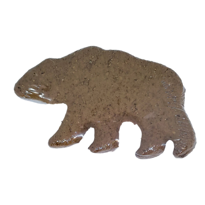 a peanut butter dog treat shaped like a bear