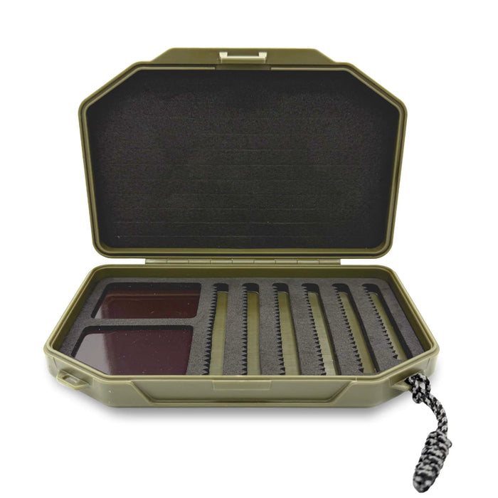open olive fly box with black interior of 3 types of fly attachment materials