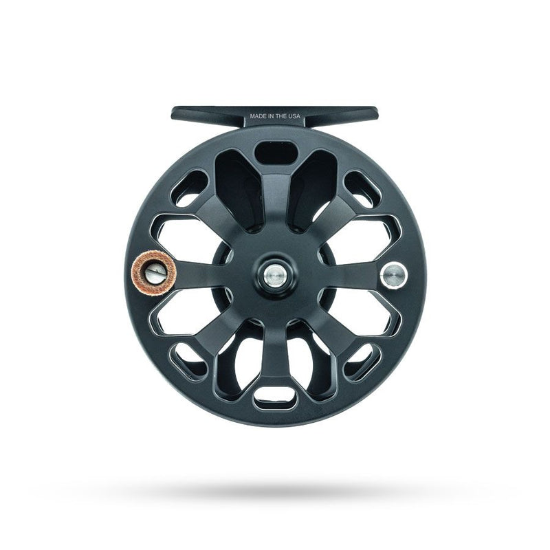 Dark gray fly fishing reel spool with cutout spokes and metal center cap