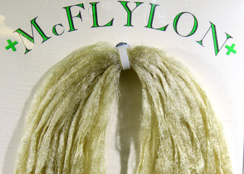 Yarn wig in olive green with tufted fringe and clip