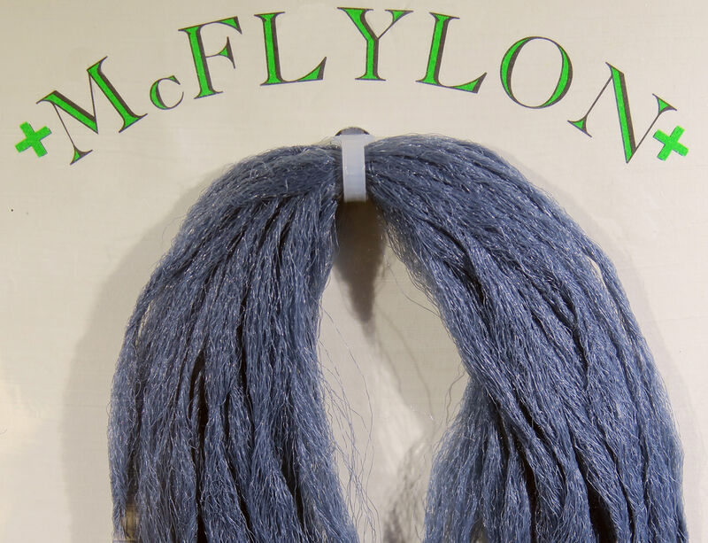 Yarn wig in dark blue with tufted fringe and clip