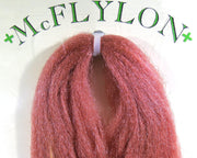 Yarn wig in rust red with tufted fringe and clip
