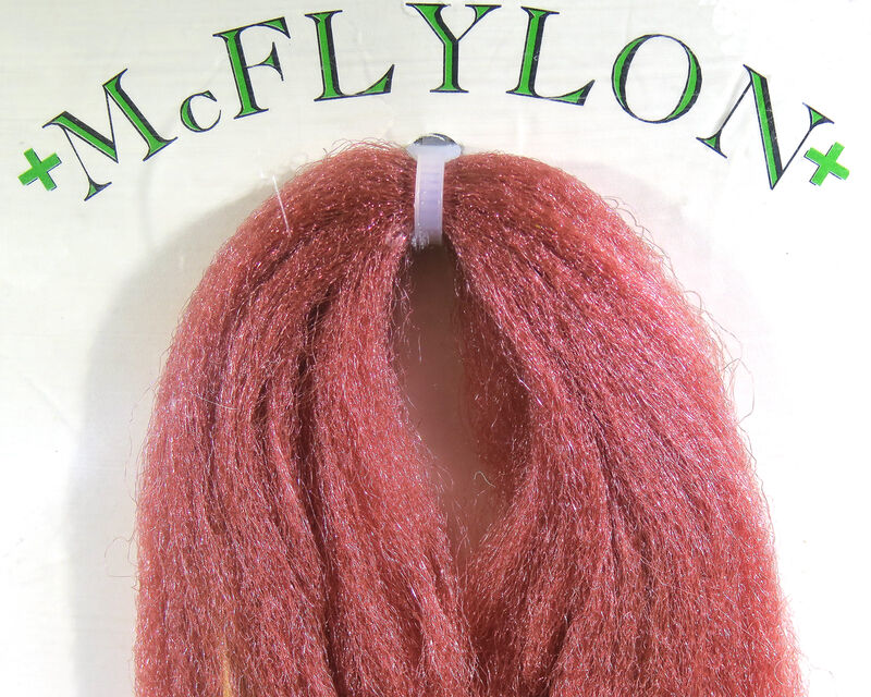 Yarn wig in rust red with tufted fringe and clip