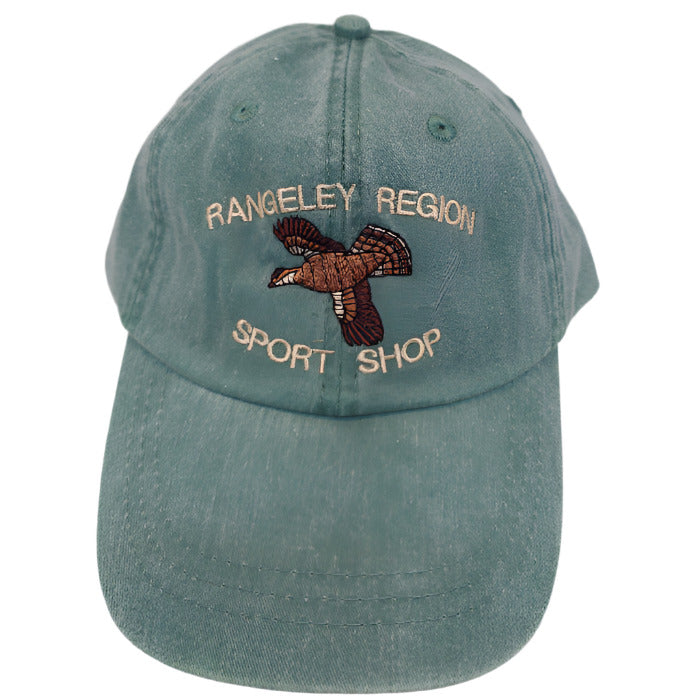 a green adams ball cap with embroidered flying grouse and shop name