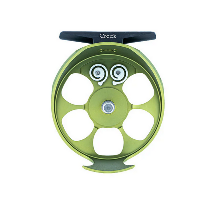 interior of olive cimarron creek fly reel showing two gray pawls