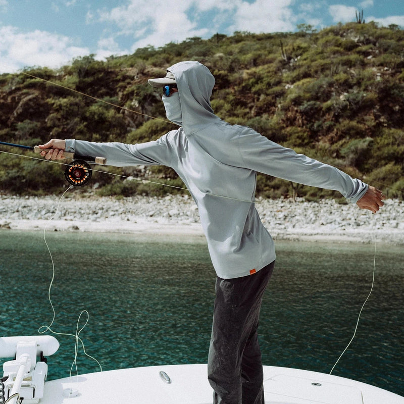 Light gray hooded sun mask hoodie on model, face covering with long sleeves